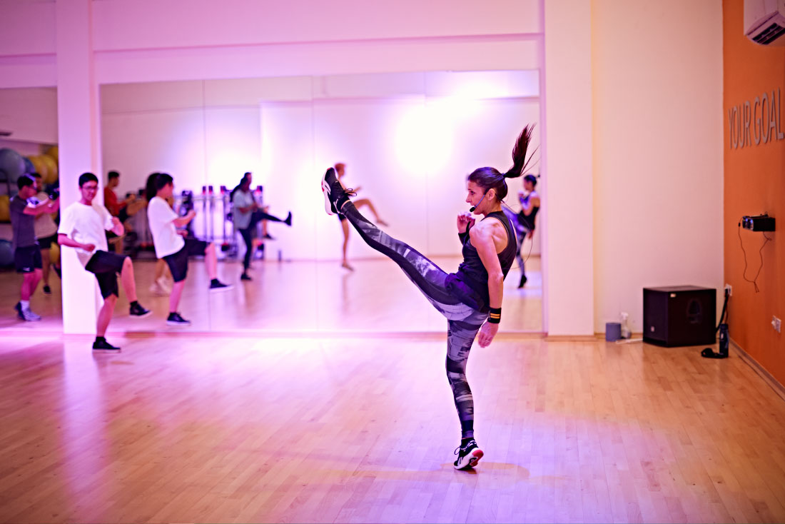 Instructor in Les Mills stance teaching class
