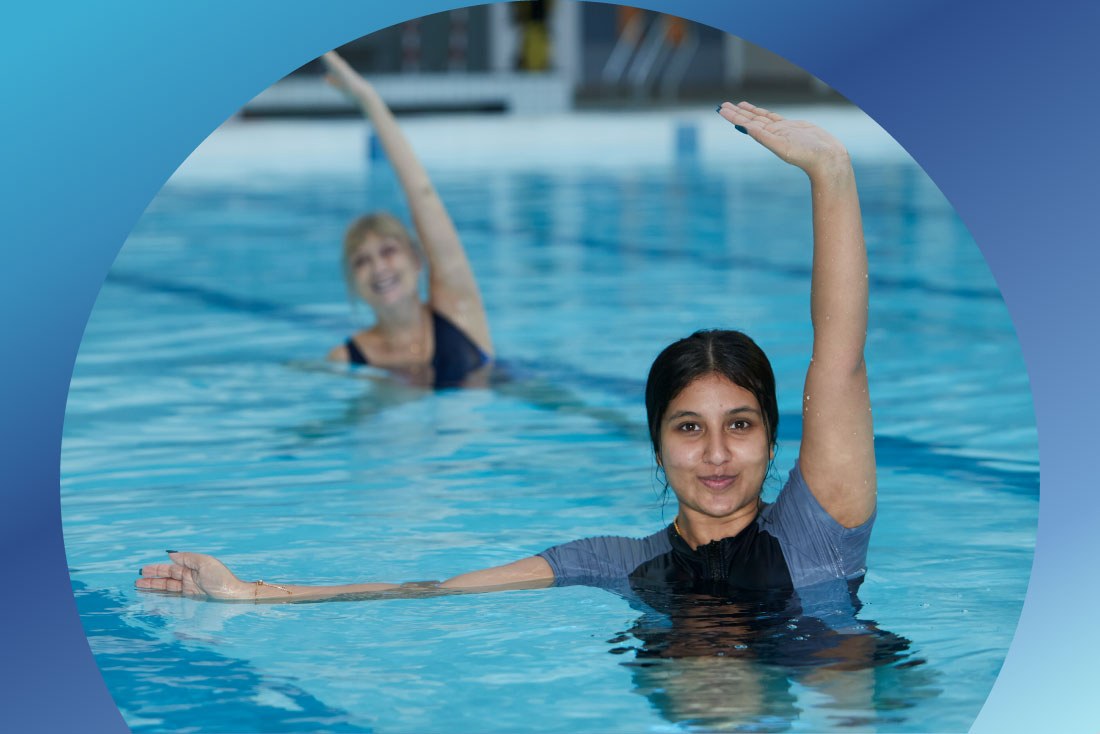 people in pool in swimming stance